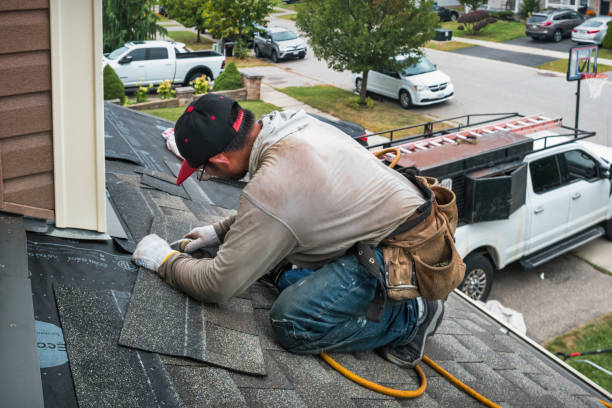 Professional Roofing technician working in Islandia, NY